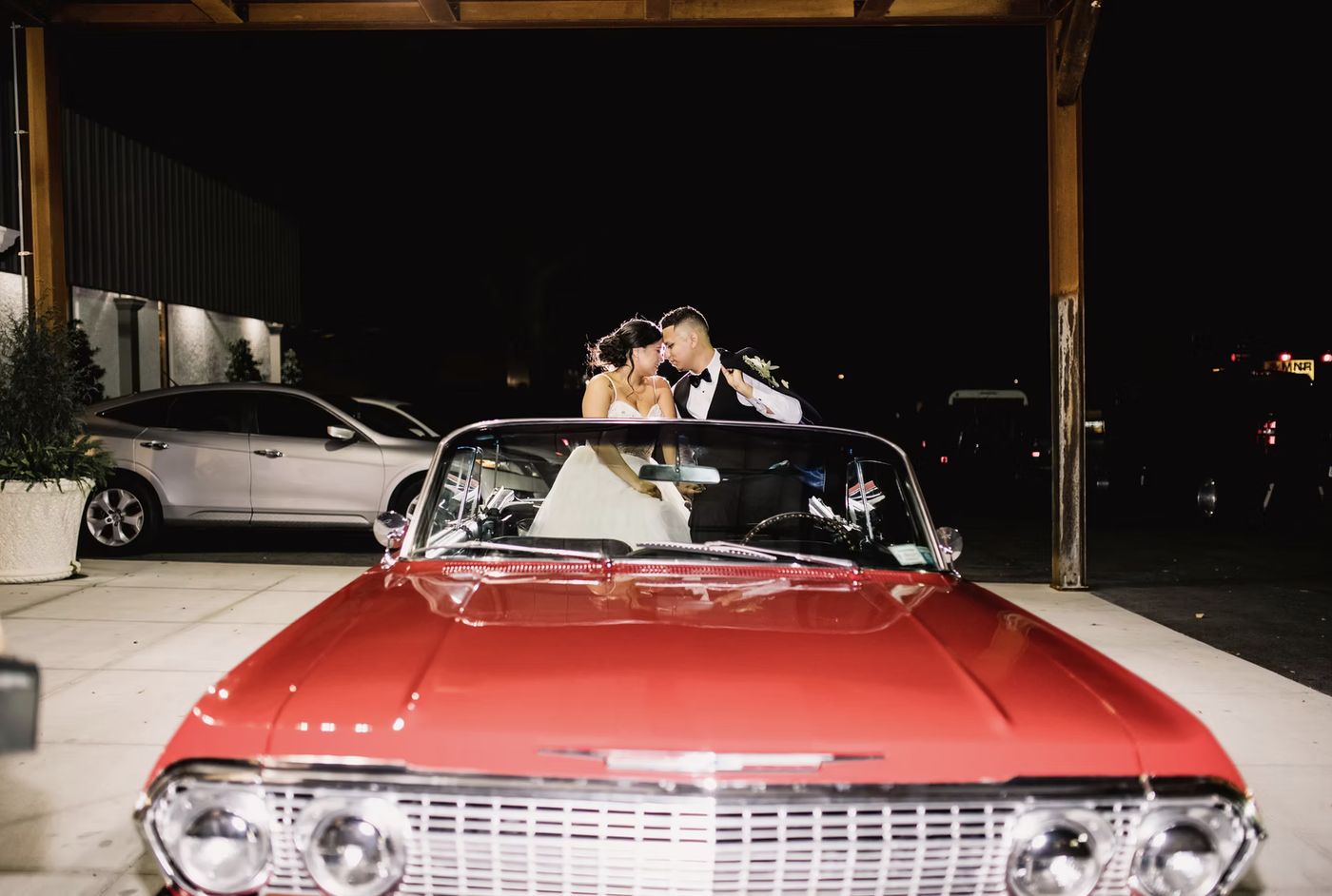 The getaway car outside the venue at night