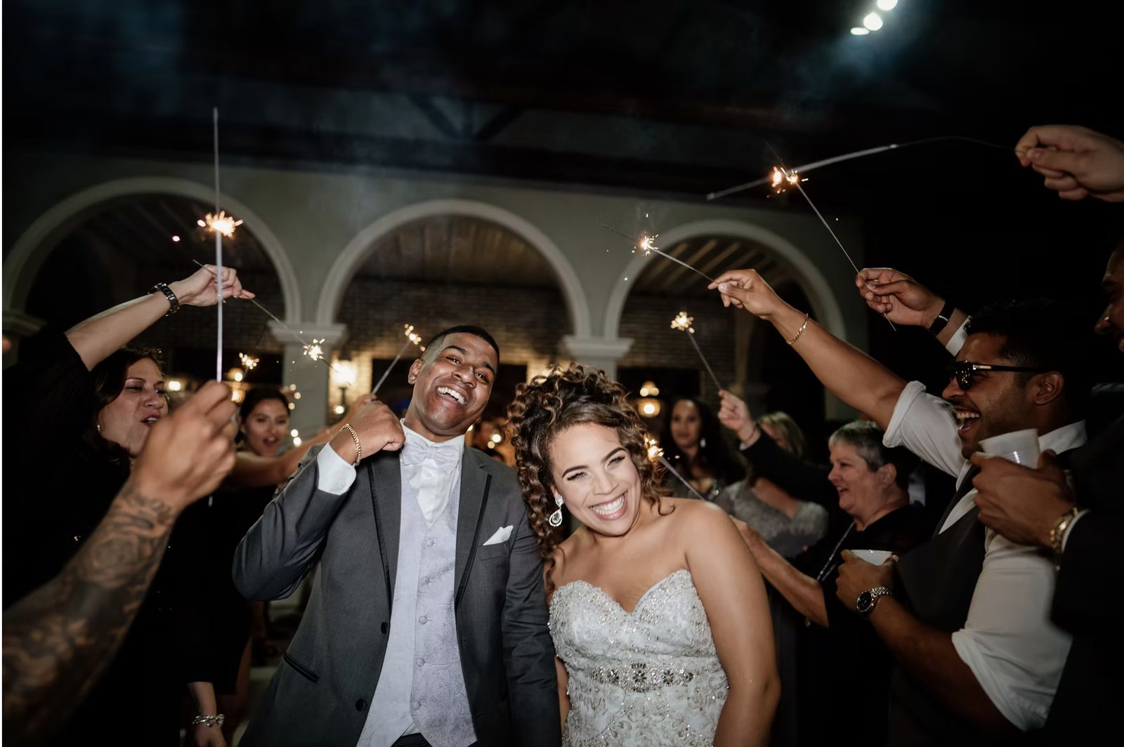 A sparkler send-off under the garden arches